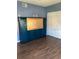 Bedroom featuring a Murphy bed and wood-look floors at 2950 Viscaya Pl # 205, Sarasota, FL 34237