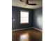 Bedroom with a ceiling fan, wood-look floors, and a window at 2950 Viscaya Pl # 205, Sarasota, FL 34237