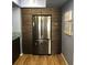 Modern kitchen features a stainless steel refrigerator with sleek, custom wood cabinets and ample storage at 2950 Viscaya Pl # 205, Sarasota, FL 34237