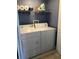 Clean laundry area featuring a white washer and dryer with storage shelving above at 2950 Viscaya Pl # 205, Sarasota, FL 34237