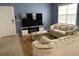 Modern living room with stylish sofas, fireplace, and tile flooring at 2950 Viscaya Pl # 205, Sarasota, FL 34237