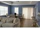 Living room with neutral tones, dining area, and large windows for natural light at 2950 Viscaya Pl # 205, Sarasota, FL 34237