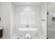 Contemporary bathroom featuring soaking tub, sleek fixtures, and natural light at 3598 Trinity St, North Port, FL 34291