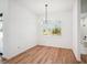 Bright dining room with modern chandelier and view of the backyard at 3598 Trinity St, North Port, FL 34291