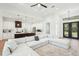 Spacious living room showcases modern design, white walls, and an open layout with the kitchen at 3598 Trinity St, North Port, FL 34291