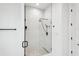 Walk-in shower featuring a glass enclosure and rain shower head at 3598 Trinity St, North Port, FL 34291
