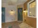 Inviting condo entrance with a decorative wreath on the dark green door and ambient lighting at 4007 Overture Cir, Bradenton, FL 34209