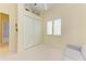 Inviting bedroom with plush carpeting, a double-door closet, and a comfortable sofa to relax on at 5304 96Th E St, Bradenton, FL 34211