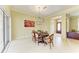 Dining room with wood table, chandelier, and view of the foyer at 5304 96Th E St, Bradenton, FL 34211