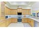 Kitchen with stainless steel appliances and plenty of cabinet space at 5304 96Th E St, Bradenton, FL 34211