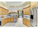 Updated kitchen with stainless appliances, tile floors, and backyard view at 5304 96Th E St, Bradenton, FL 34211