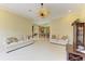 Open living room with tile flooring and neutral walls leads to kitchen and dining areas at 5304 96Th E St, Bradenton, FL 34211
