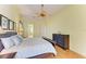 Comfortable main bedroom with wood floors, a ceiling fan, and natural light at 5304 96Th E St, Bradenton, FL 34211