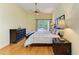 Comfortable main bedroom with wood floors, a ceiling fan, and natural light at 5304 96Th E St, Bradenton, FL 34211