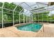 This pool area is fully screened in and features a spa, perfect for swimming and entertaining at 5304 96Th E St, Bradenton, FL 34211