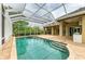 Enjoy the screened-in pool with spa and backyard access, offering a private oasis for relaxation and recreation at 5304 96Th E St, Bradenton, FL 34211