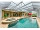 The screened-in pool and spa offer a luxurious outdoor retreat, complete with a relaxing atmosphere at 5304 96Th E St, Bradenton, FL 34211