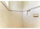 Tiled shower with a built-in niche and decorative trim at 5304 96Th E St, Bradenton, FL 34211