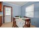 Charming dining area features a round table, wood chairs, and a sunlit window at 5808 13Th Street E Ct, Bradenton, FL 34203