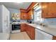 Bright kitchen with classic appliances, ample counter space, and wooden cabinets at 5808 13Th Street E Ct, Bradenton, FL 34203