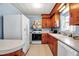 Kitchen features classic appliances and wood cabinetry providing ample storage space at 5808 13Th Street E Ct, Bradenton, FL 34203