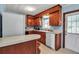 Kitchen features white appliances, lots of storage, and plenty of countertop space at 5808 13Th Street E Ct, Bradenton, FL 34203