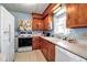Bright kitchen with classic appliances, ample counter space, and wooden cabinets at 5808 13Th Street E Ct, Bradenton, FL 34203