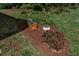 Beautiful landscaped area with mulch and several planted decorative pots and garden at 5808 13Th Street E Ct, Bradenton, FL 34203