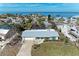 Charming waterfront home with a well-maintained lawn and serene ocean view at 609 Foxworth Ln, Holmes Beach, FL 34217