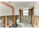Bathroom with exposed walls, awaiting your personal touch at 609 Foxworth Ln, Holmes Beach, FL 34217