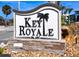 Key Royale community sign surrounded by mulch and greenery at 609 Foxworth Ln, Holmes Beach, FL 34217