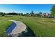 Scenic golf course view with a sand trap and lush green fairway under a clear blue sky at 609 Foxworth Ln, Holmes Beach, FL 34217