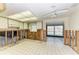 Spacious unfinished kitchen showing white cabinetry and abundant natural light at 609 Foxworth Ln, Holmes Beach, FL 34217
