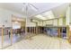 Renovation of a kitchen with tile flooring, wood framing, and white and green cabinets at 609 Foxworth Ln, Holmes Beach, FL 34217