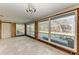 Living room being remodeled, with large windows and sliding door to outdoor pool at 609 Foxworth Ln, Holmes Beach, FL 34217