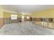 Spacious room under renovation features unfinished walls and abundant natural light through large windows at 609 Foxworth Ln, Holmes Beach, FL 34217