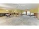 Large unfinished room showing exposed framing and large windows offering bright natural light at 609 Foxworth Ln, Holmes Beach, FL 34217