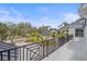 Charming balcony with wrought iron railings offering views of the neighborhood and surrounding greenery at 656 Tropical Cir, Sarasota, FL 34242