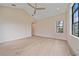Bedroom with vaulted ceilings, and ample natural light offers a clean and spacious feel at 656 Tropical Cir, Sarasota, FL 34242