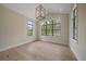 Bright bedroom featuring large windows, natural light, and sleek hardwood floors offers a tranquil retreat at 656 Tropical Cir, Sarasota, FL 34242