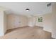 Upstairs bedroom with neutral walls, wood floors, and an abundance of natural light at 656 Tropical Cir, Sarasota, FL 34242