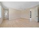 Large bedroom with wood floors, ceiling fan, and ensuite bathroom at 656 Tropical Cir, Sarasota, FL 34242