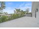 Large outdoor deck area with metal railings and view of surrounding neighborhood at 656 Tropical Cir, Sarasota, FL 34242