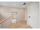 Upstairs hallway with wood floors, interior door, and landing at 656 Tropical Cir, Sarasota, FL 34242