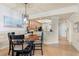 Open-concept dining area and kitchen view, featuring stylish furnishings and plenty of natural light at 7149 River Hammock Dr # 101, Bradenton, FL 34212