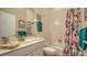 Bathroom featuring vanity and a shower and tub combo with vibrant curtains at 92 Tall Trees Ct, Sarasota, FL 34232