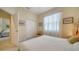 Bright bedroom featuring a ceiling fan, closet and a neutral decor at 92 Tall Trees Ct, Sarasota, FL 34232