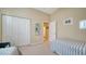 Bedroom with a closet, and view to a hallway and another room at 92 Tall Trees Ct, Sarasota, FL 34232