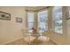 Bright breakfast nook with a glass table and window views at 92 Tall Trees Ct, Sarasota, FL 34232