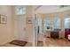 Inviting entryway leading to a bright office with hardwood floors and large windows at 92 Tall Trees Ct, Sarasota, FL 34232